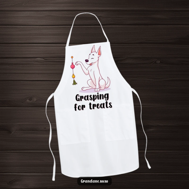Funny Grand Dane apron showing a large dog reaching for a dangling toy, ideal for kitchen fun and dog lovers.