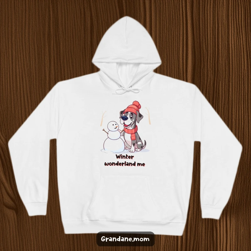 Funny Great Dane Hoodie: A Great Dane wearing a hat builds a snowman, radiating cheerful winter vibes and warmth.