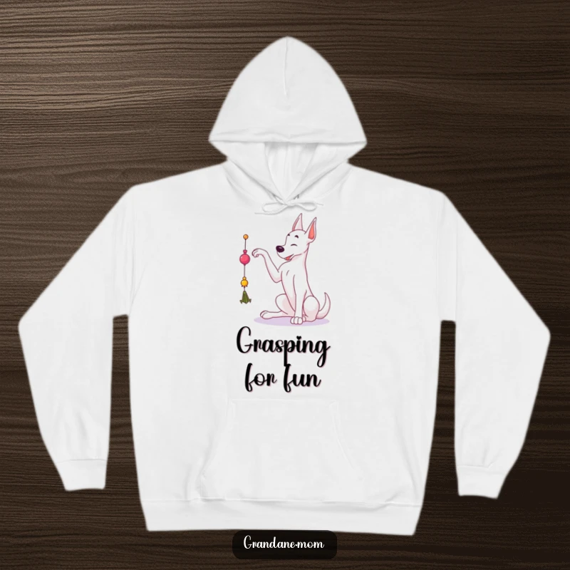Funny Grand Dane hoodie depicting a large dog reaching gracefully for a dangling toy, illustrating boundless energy and humor.
