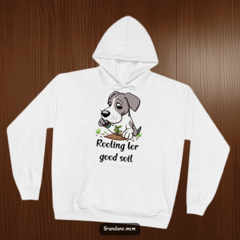 Funny Great Dane gardener hoodie showing a large dog in gardening gloves, planting a tiny seedling with care.