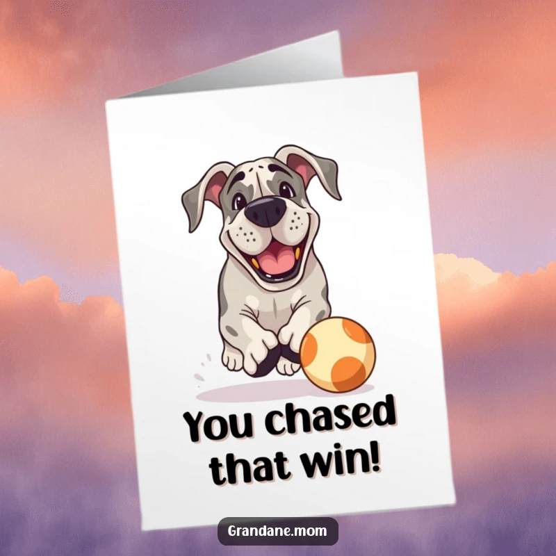 Funny Free Printable Congrats Card showing a Grand Dane dog chasing a large ball with a playful grin.