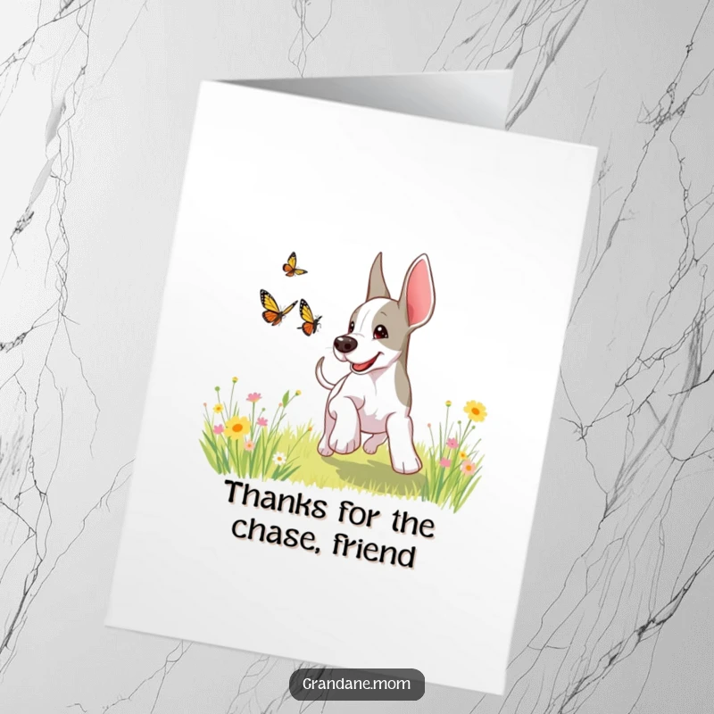 Funny Free Printable Thank You Card: A playful Grand Dane enthusiastically chases a butterfly across a sunny meadow, a picture of pure happiness.