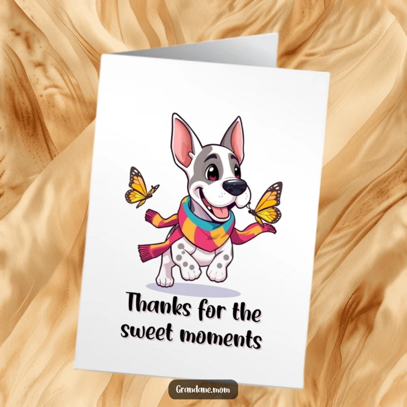 Funny Free Printable Thank You Card: Grand Dane in a scarf excitedly chasing a butterfly, expressing thanks.