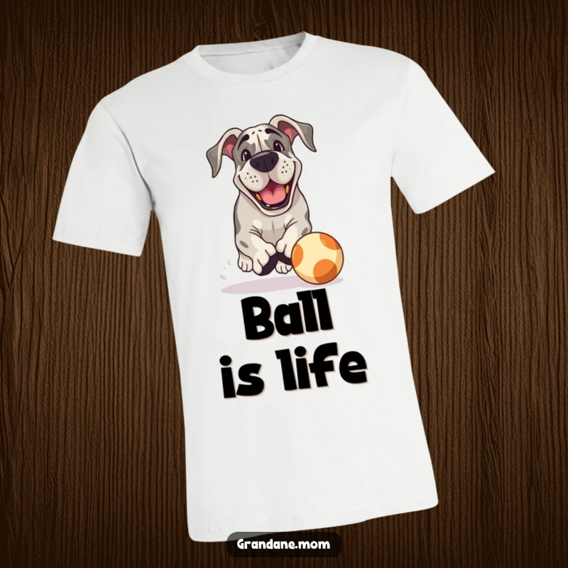 Funny Grand Dane T-Shirt: A grinning Grand Dane joyfully chases a large bouncing ball, showcasing pure, playful canine energy.
